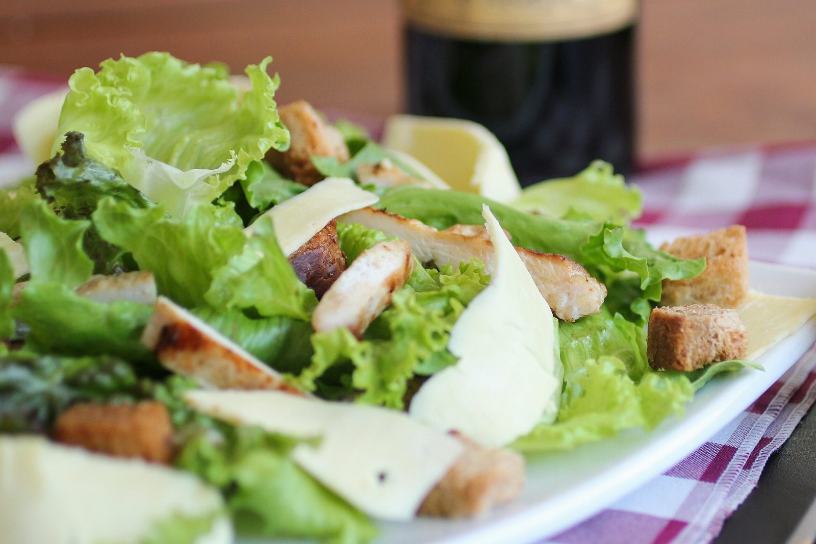 meat with lettuce on white ceramic plate