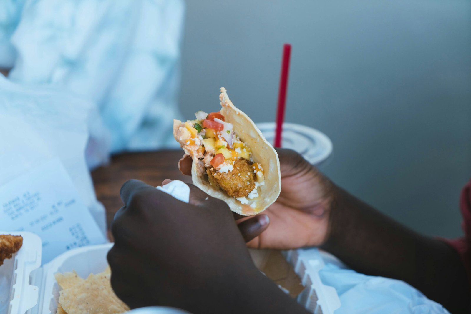 person holding white and brown food