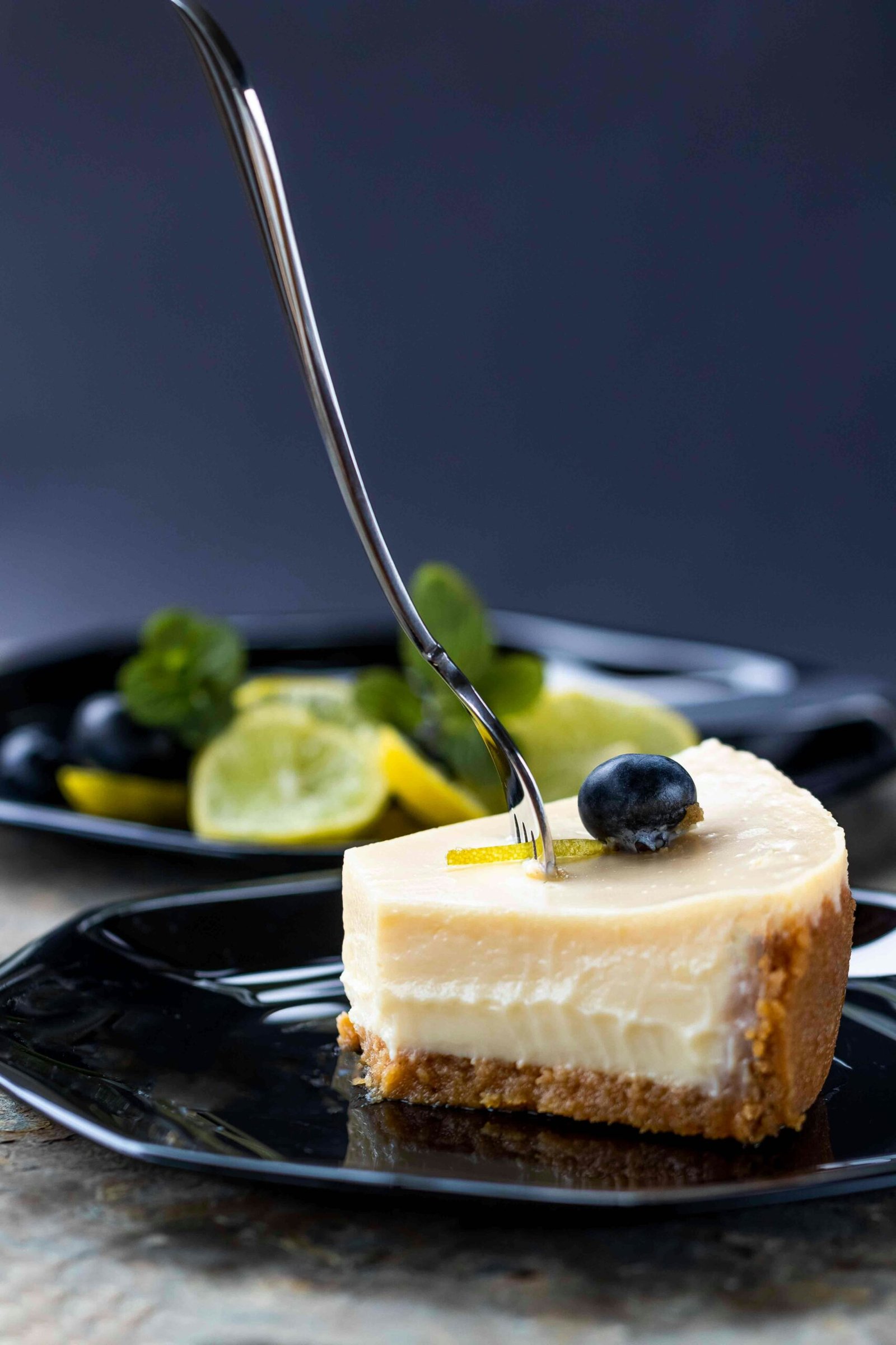 sliced cake on black plate